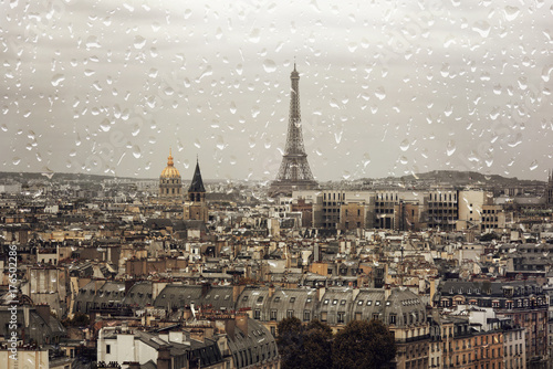 Rain in Paris, Eiffel tower in autumn day, rainy day over the city