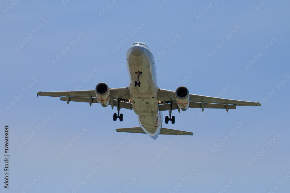 Passenger Airplane Taking Off Into The Blue Sky Passenger Airplane Taking Off Into The Blue Sky