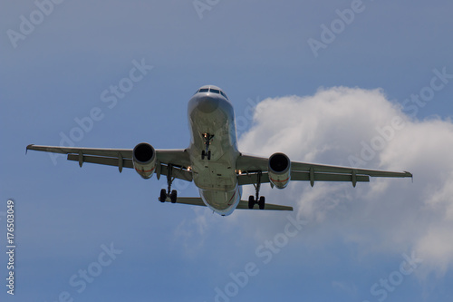 Passenger Airplane Taking Off Into The Blue Sky