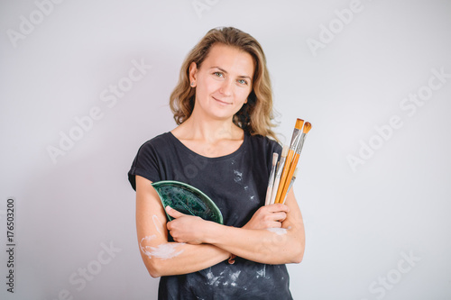 portrait of Potter with brushes in her workplace photo