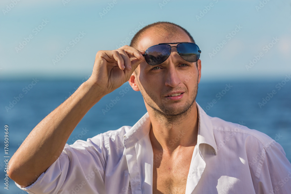 Portrait of a man on a background of water Portrait of a man on a background of water