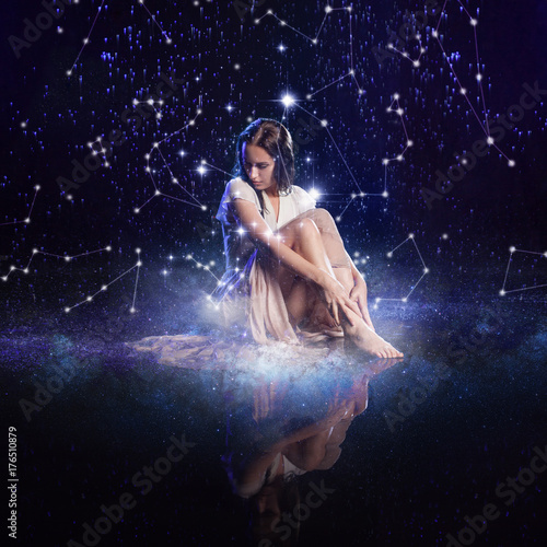 Photo art, young woman dreams to starry sky. Elements of this image furnished by NASA.