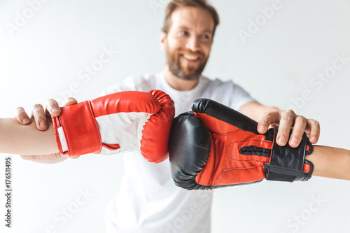 trainer and boys in boxing gloves © LIGHTFIELD STUDIOS