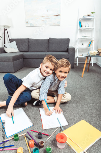 little boys drawing together