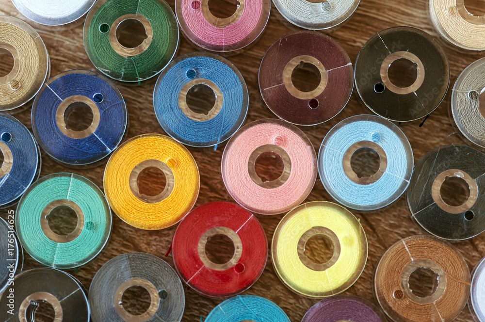 Fototapeta premium Close-up on colored sewing threads on spools