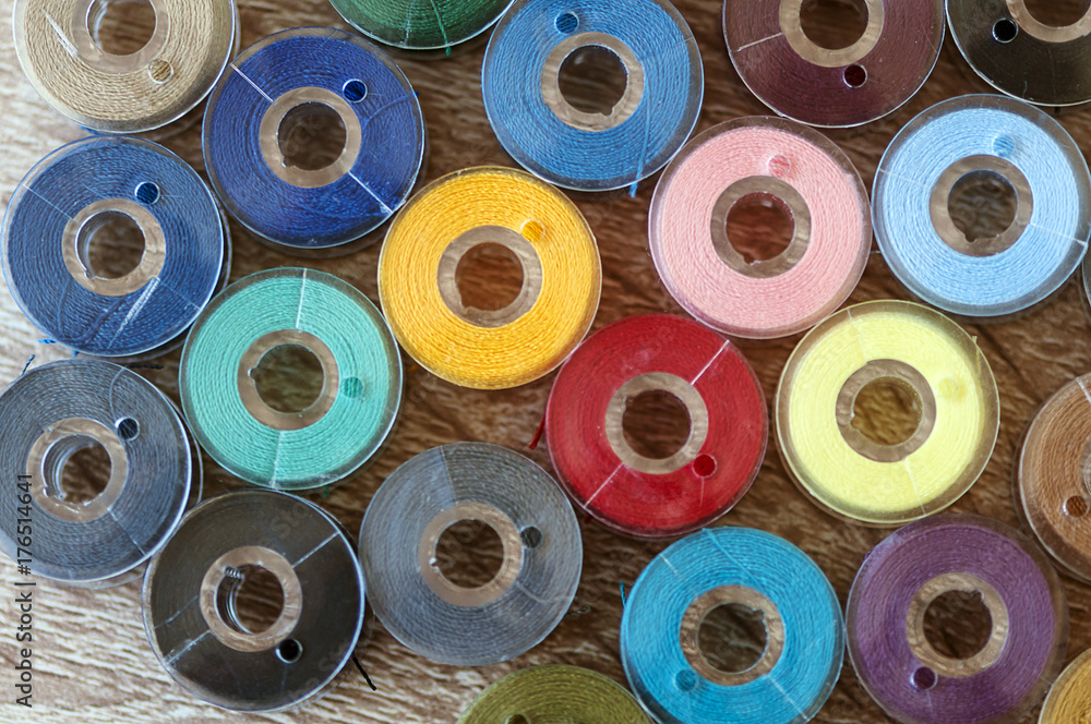 Fototapeta premium Close-up on colored sewing threads on spools