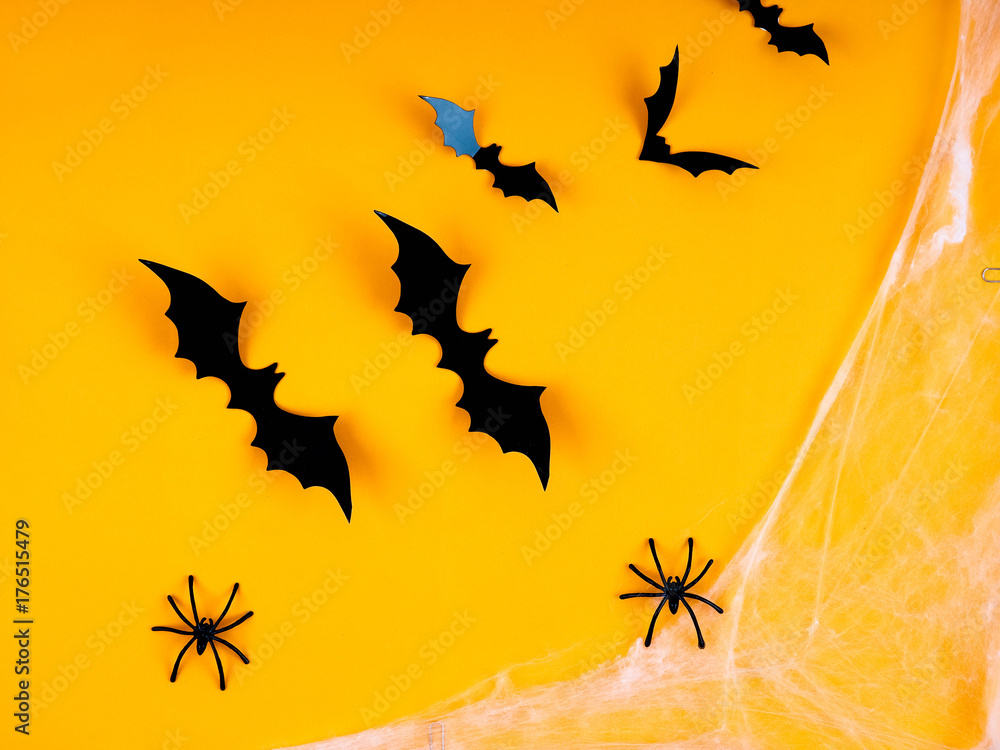 bat Halloween orange bright Vaughn, copy space, cute, humorous backdrop for a fun filled holiday, flat lay, black spiders and pumpkin.