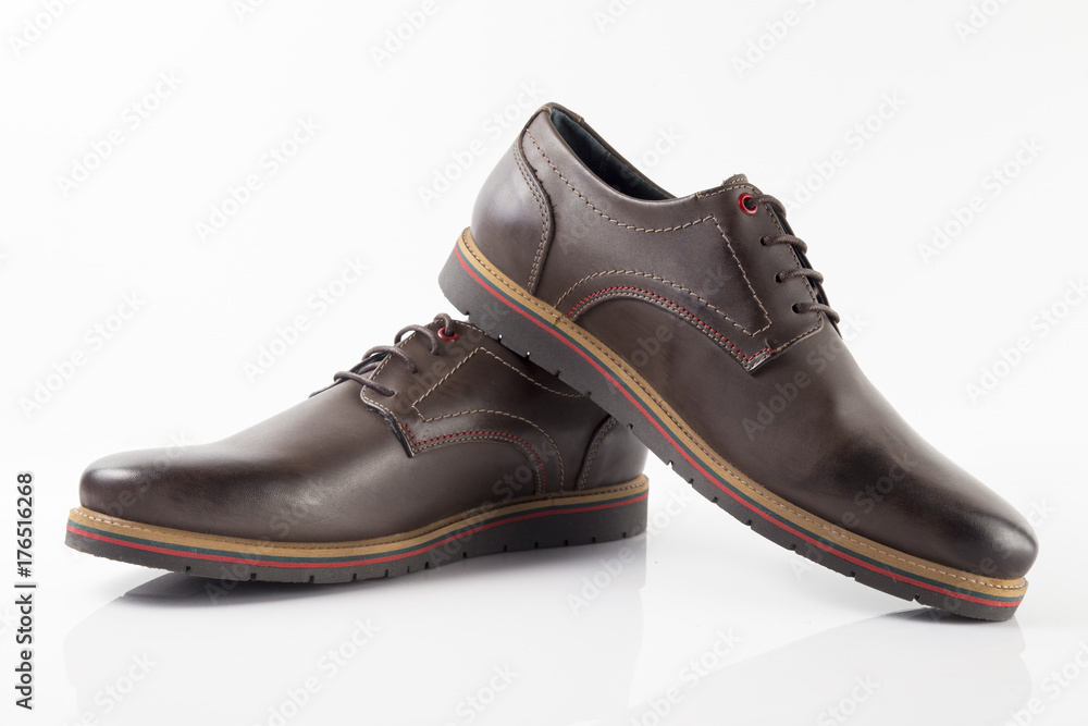 Male brown leather shoe on white background, isolated product.