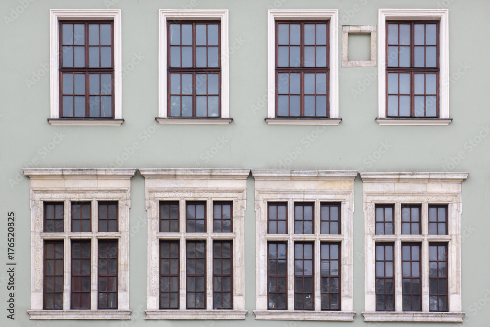 Eight Windows on the facade of the old vintage houses