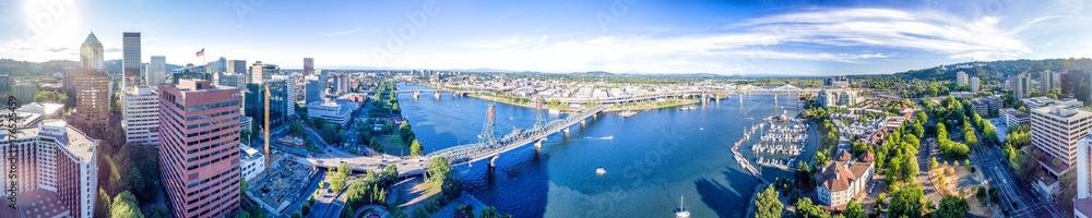 PORTLAND, OR - AUGUST 18, 2017: Aerial view of cityscape and Willamette River. Portland attracts 5 million tourists annually