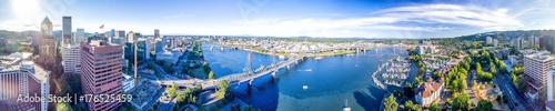 PORTLAND, OR - AUGUST 18, 2017: Aerial view of cityscape and Willamette River. Portland attracts 5 million tourists annually