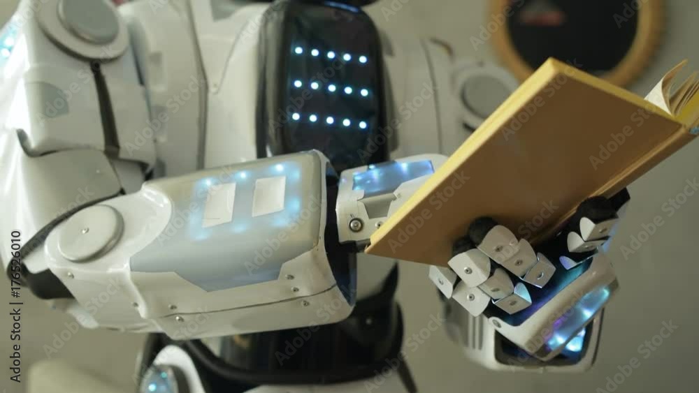 Close up of robotic machine reading book Close up of robotic machine reading book