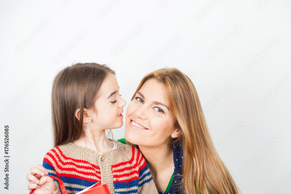 Woman with daughter celebrating Christmas at home Woman with daughter celebrating Christmas at home