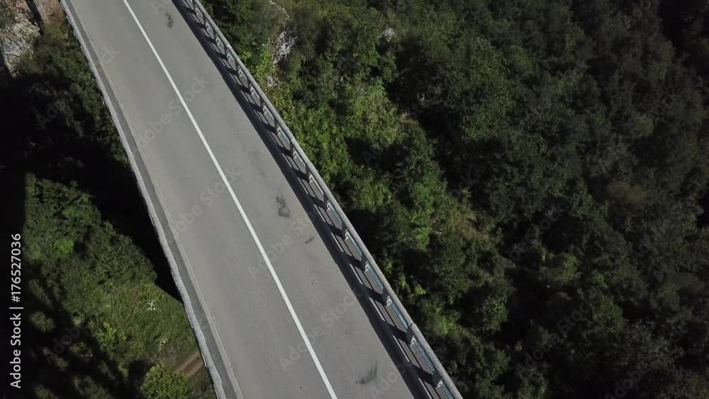 People and traffic on the bridge over the deep canyon, aerial People and traffic on the bridge over the deep canyon, aerial