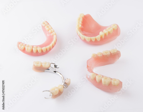 Group of dentures on white background