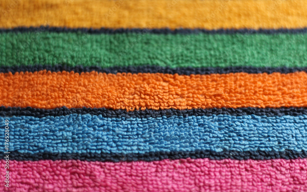 Cotton terry multicolored towel cloth fabric striped texture close up view background 
