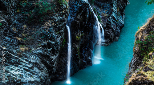 Photography River in making; streams converging into river; blue water of river