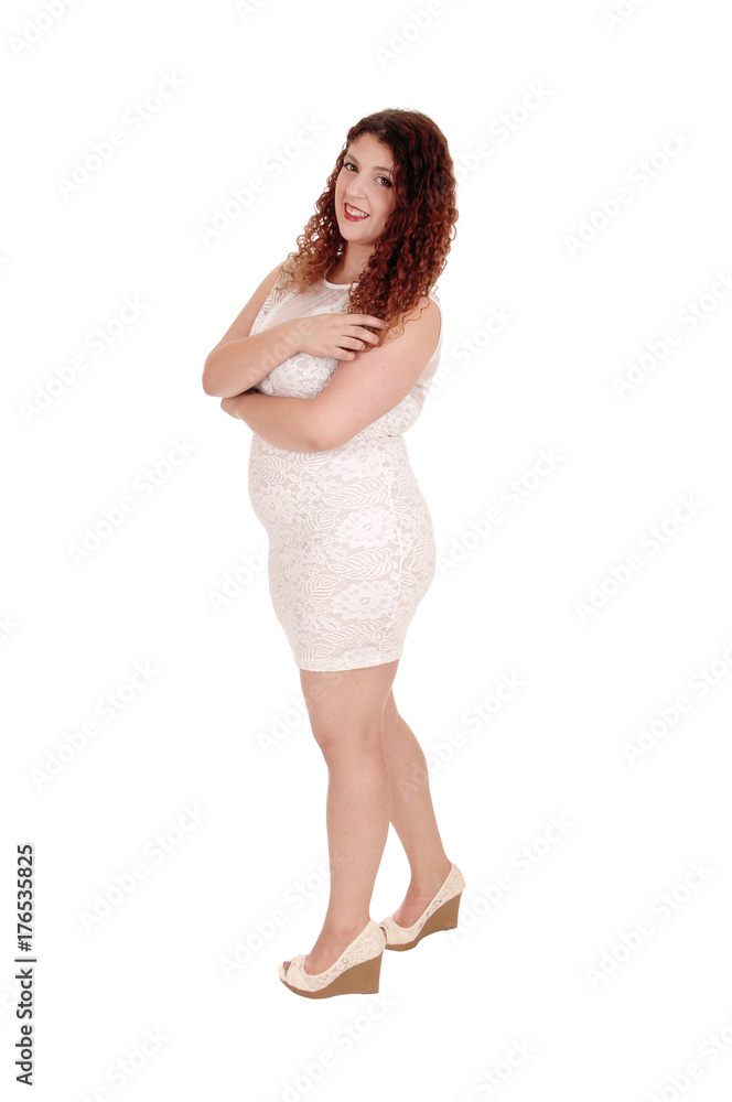 Woman standing in full length in beige dress Woman standing in full length in beige dress