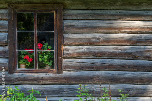 Old-fashioned window of wooden house
