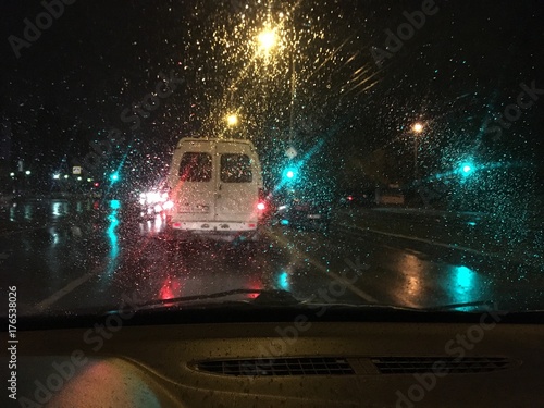 view through frontal window on rainy night