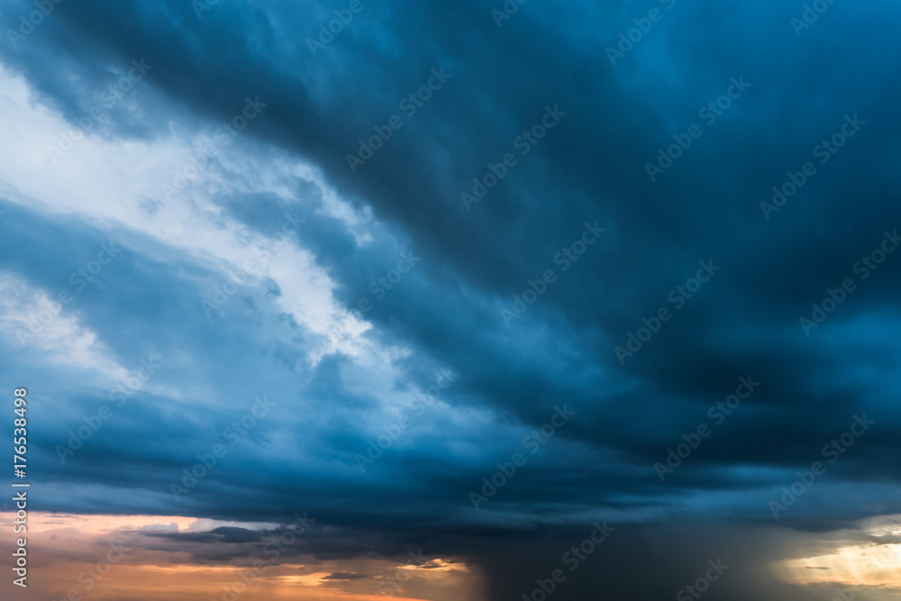storm cloud background during raining. Dark Clouds. Huge black clouds on dark sky.