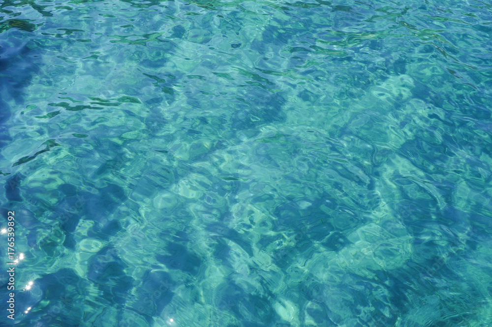 Surface water of blue color with ripples. Seamless texture.