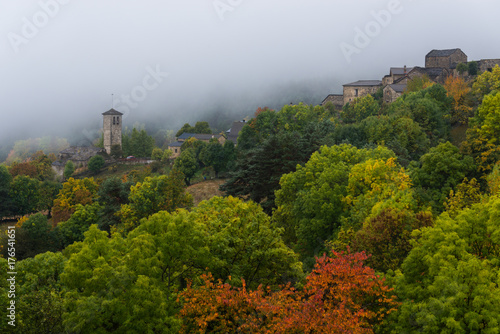 The small village of Fanlo (Huesca) wrapped between fog and vegetation