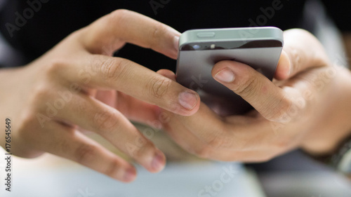 Man hands holding a smart phone