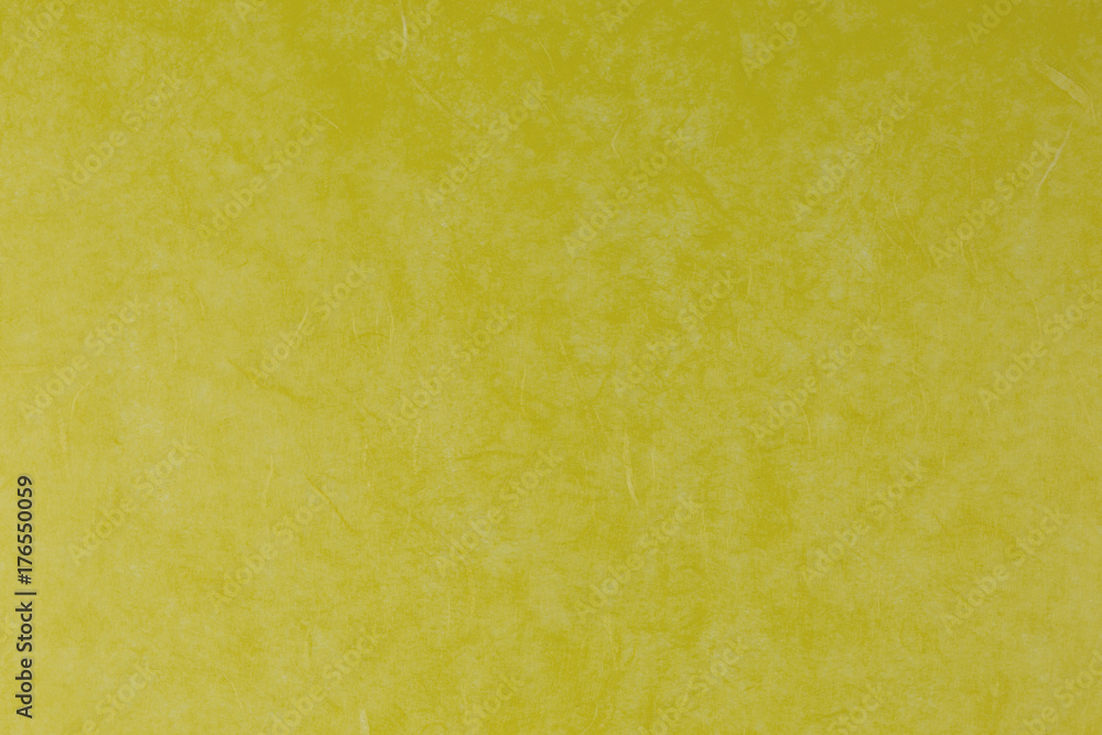 Fototapeta premium yellow paper background with silk fibres