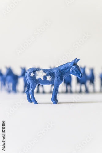 United States Democratic Donkey Standing In Front of a Row of Blue Donkeys