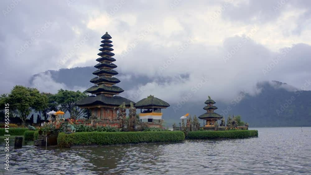 The water of Beratan lake is flowing around the tiered pagoda of temple Pura Ulun Danu, Bedugul province, Bali, Indonesia The water of Beratan lake is flowing around the tiered pagoda of temple Pura Ulun Danu, Bedugul province, Bali, Indonesia
