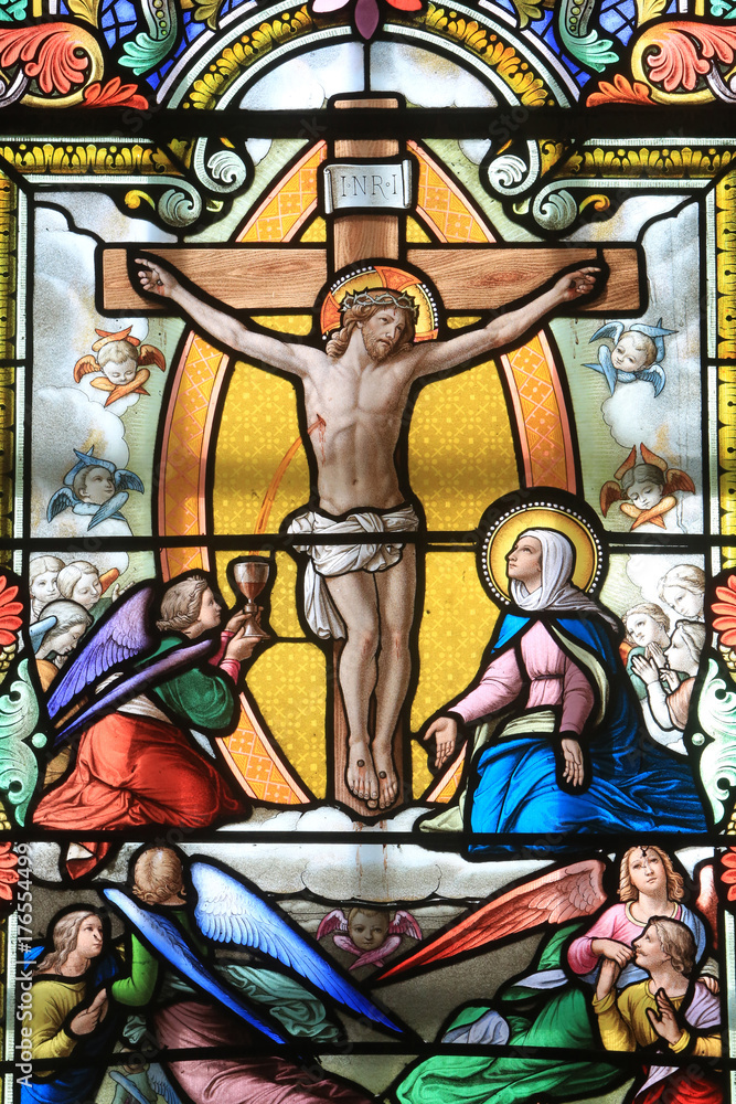 Jesus Christ on the cross. Stained glass window. Shrine of Our Lady of