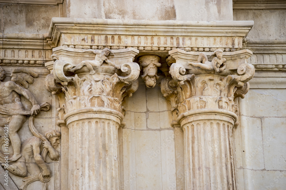 corinthian capital, Details of stone sculptures of the facade of the University of Alcalá de Henares. Madrid, Spain.