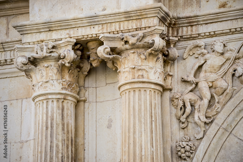 Columns, Details of stone sculptures of the facade of the University of Alcalá de Henares. Madrid, Spain.