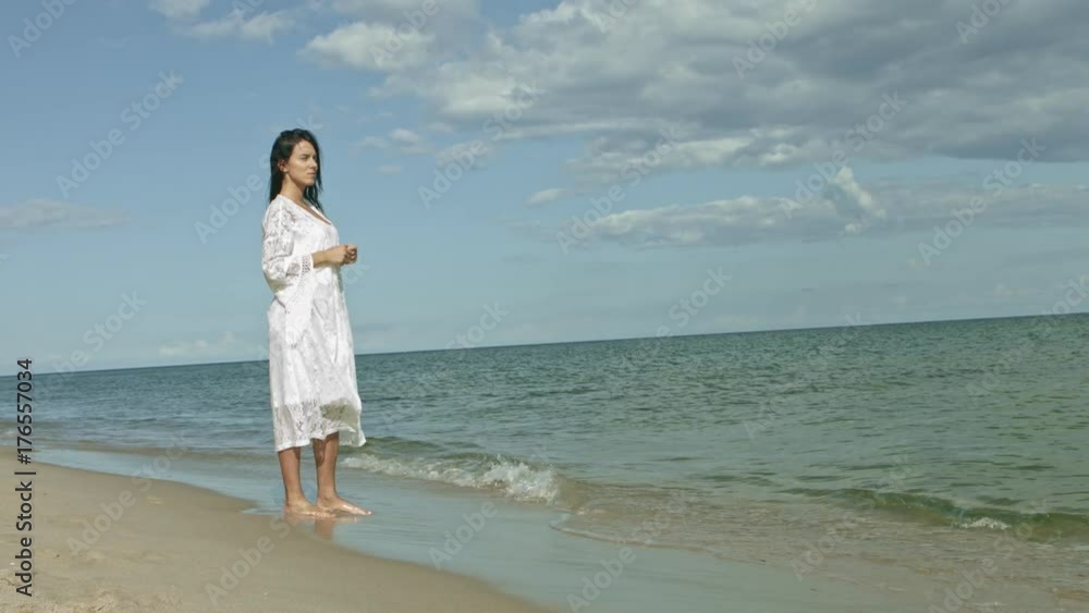 Woman looking at ocean view thinking about life Woman looking at ocean view thinking about life