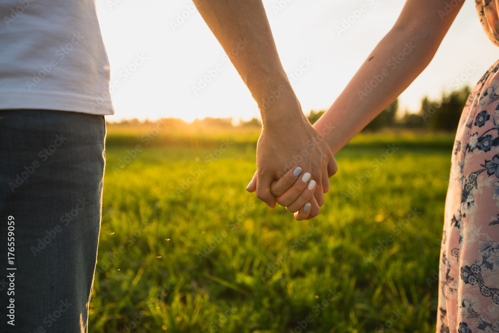A couple holding hands. Closeup A couple holding hands. Closeup