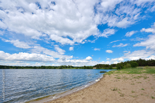 Fototapeta Naklejka Na Ścianę i Meble -  Landscape with river and blue sky reflection