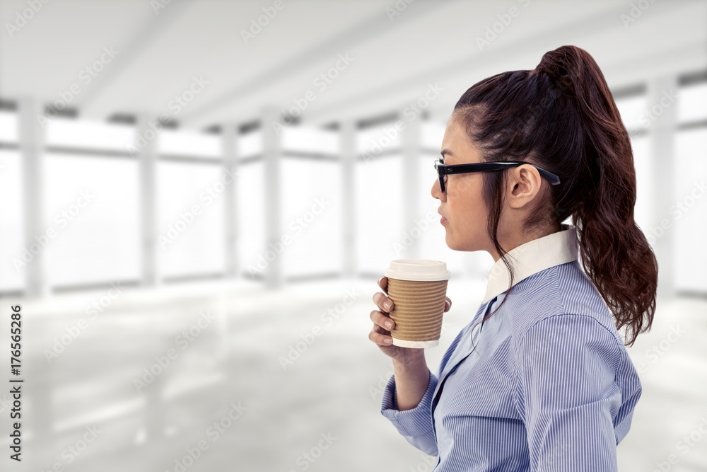 Composite image of businesswoman holding disposable cup and Composite image of businesswoman holding disposable cup and