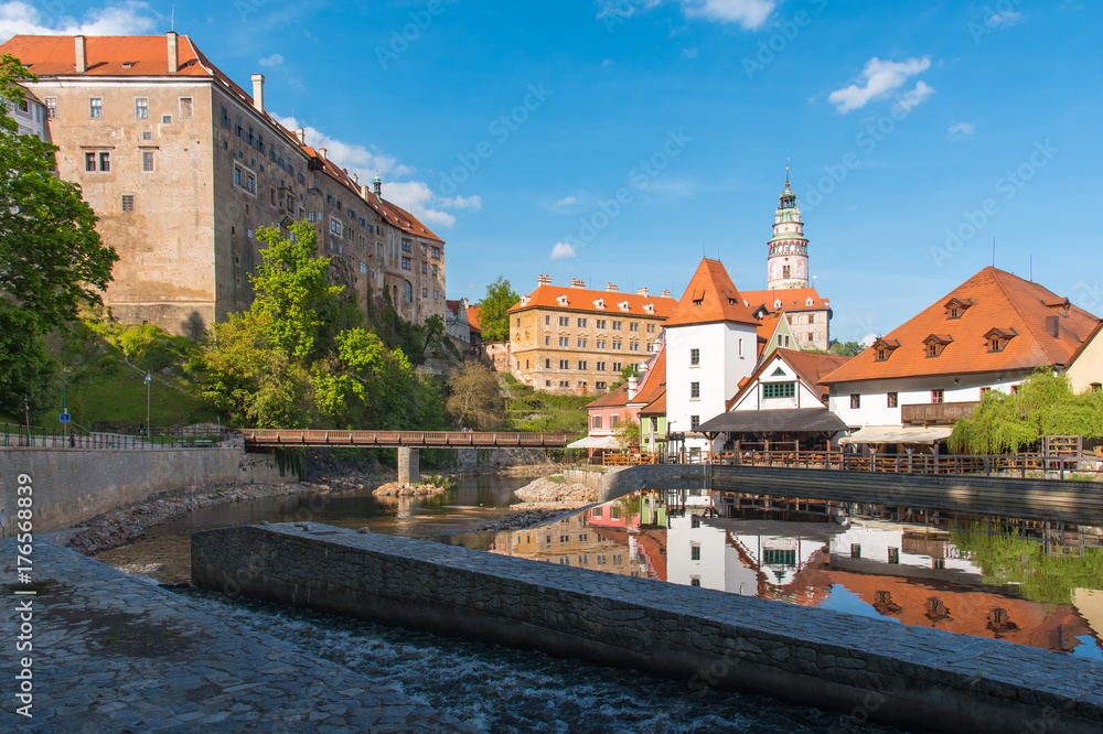 Cesky Krumlov in sunny day with building reflection in the river