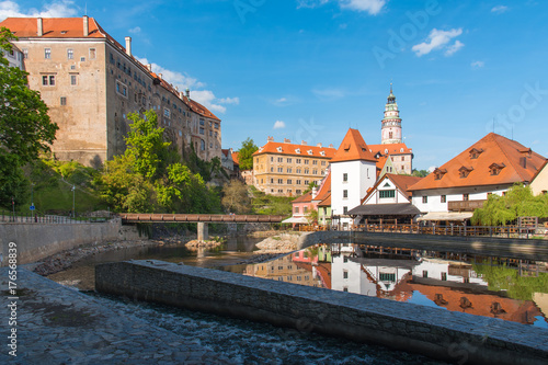 Cesky Krumlov in sunny day with building reflection in the river