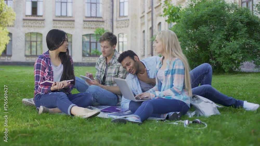 Senior students communicating, having rest on campus outdoors, education Senior students communicating, having rest on campus outdoors, education