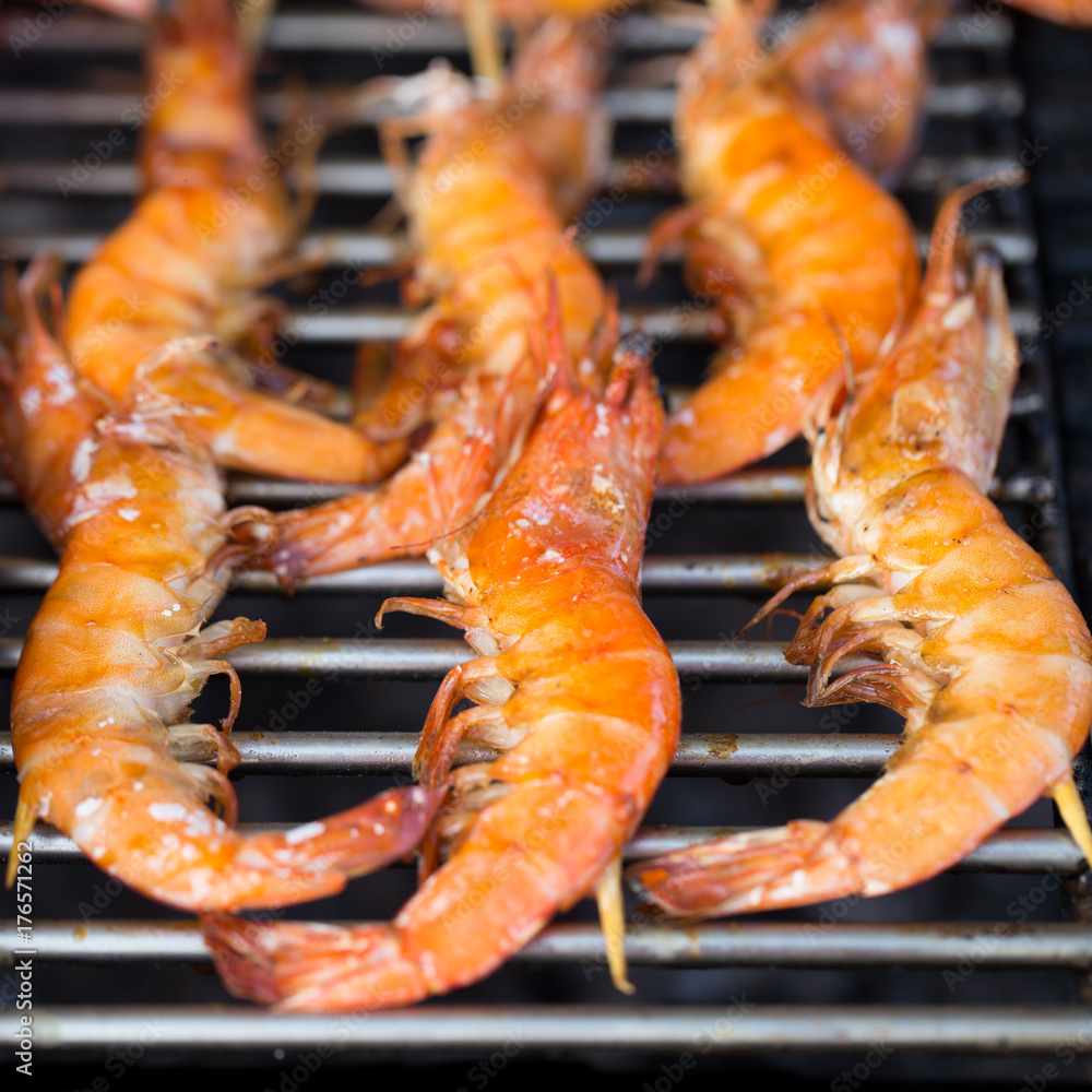 Fresh shrimps on barbecue outdoors Fresh shrimps on barbecue outdoors