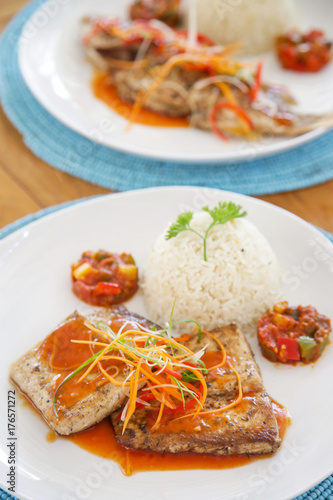 Fish fillets served with rice