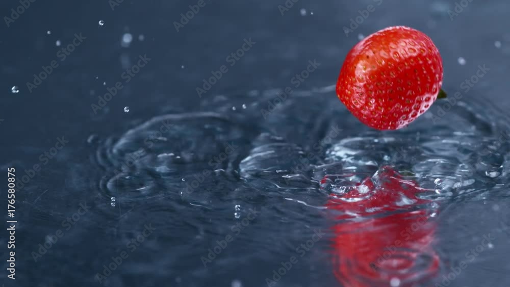 Fresh red strawberry falling and splashing into clean fresh water, Fresh red strawberry falling and splashing into clean fresh water,