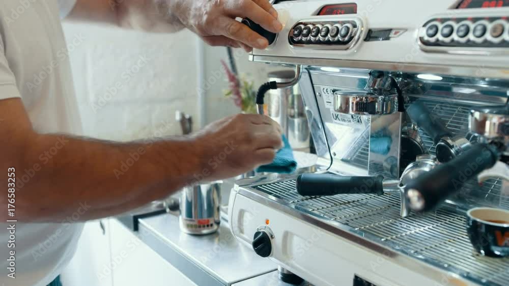 Close up hands of cafe barista preparing fresh espresso from coffee machine Close up hands of cafe barista preparing fresh espresso from coffee machine