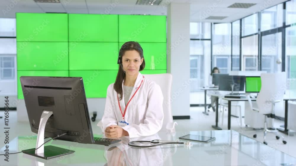 Healthcare worker assisting a patient over the phone, with green background Healthcare worker assisting a patient over the phone, with green background