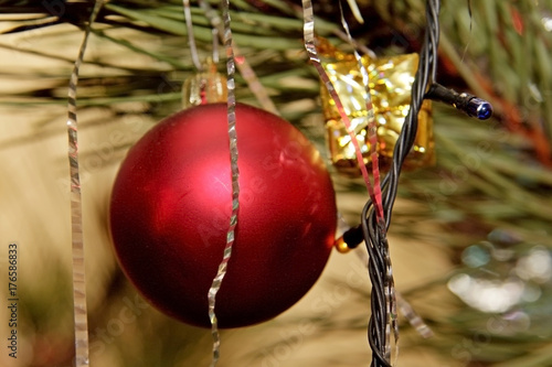 New Year's toys on Christmas tree for Christmas photo