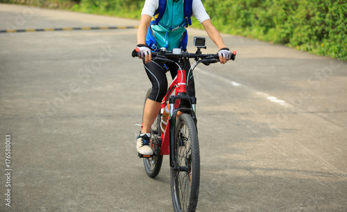 cyclist cycling mountain bike on trail © lzf