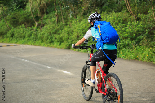 cyclist cycling mountain bike on trail © lzf