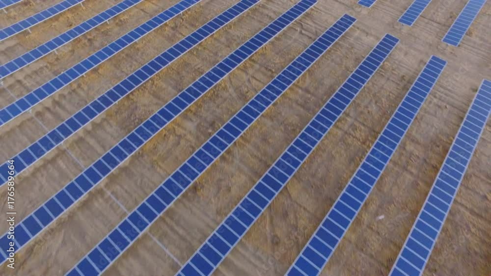 Solar and wind farm, fly over, aerial view Solar and wind farm, fly over, aerial view